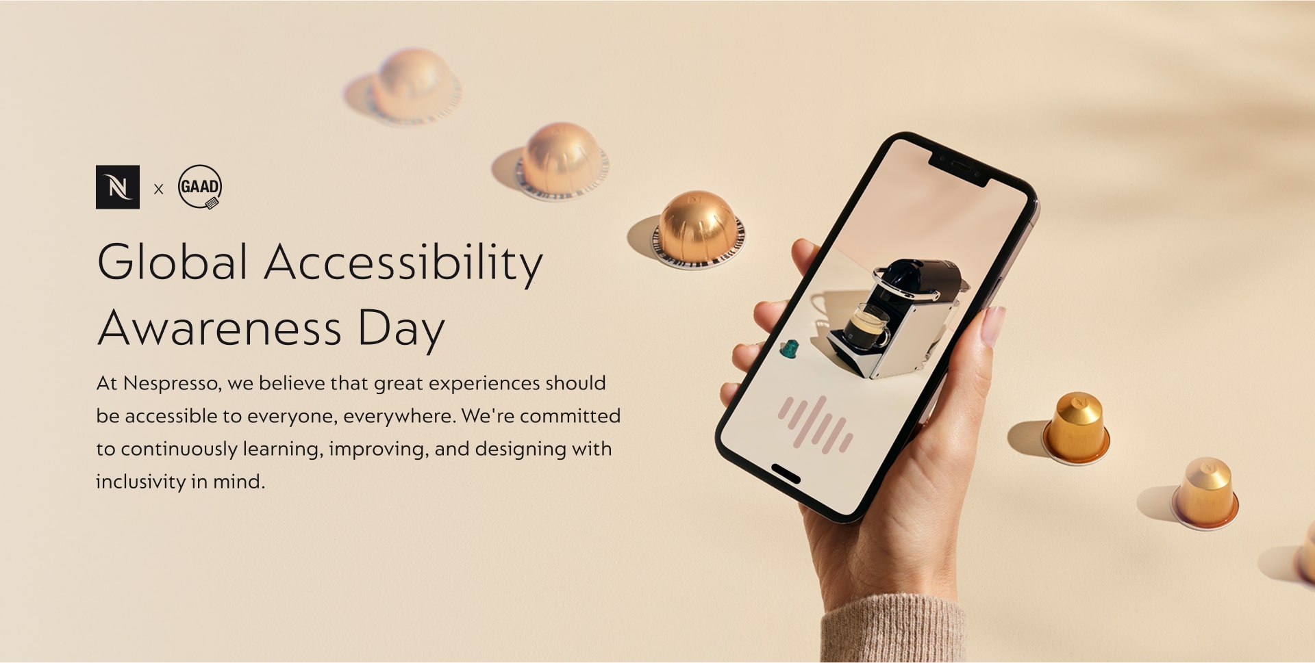 Nespresso accessibility work, a hand holding a phone showing the Nespresso product. On the left reads Global Accessibility awareness day